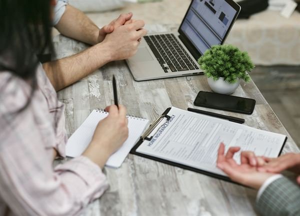 A couple reviewing insurance options with a professional advisor